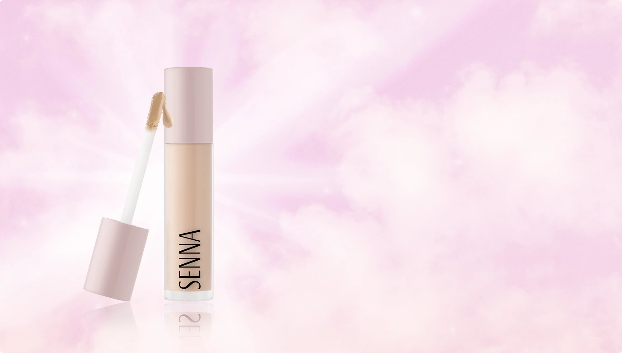Luminous Lift Concealer tube and cap against pink illuminated background
