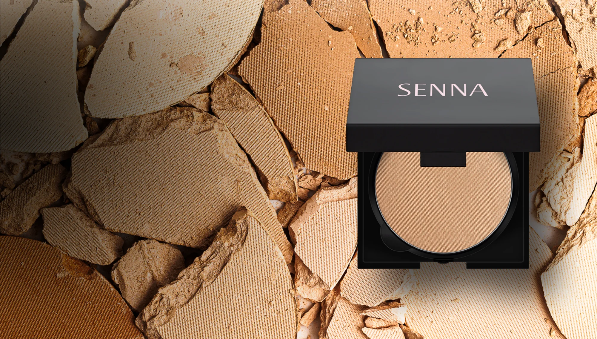 Open Senna powder compact displayed against a cracked makeup background.